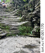 Winding Stone Steps Surrounded by Lush Nature and Scenic Landscapes for Exploration. Стоковое фото, фотограф David Kashakhi / Фотобанк Лори