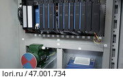 Dubai, UAE - June 2024: Data Storage Rack designed specifically for various Server Components and configurations. Редакционное фото, фотограф David Kashakhi / Фотобанк Лори