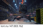Industrial Metal Foundry Featuring Heavy Machinery Operatively Working in Action. Стоковое фото, фотограф David Kashakhi / Фотобанк Лори