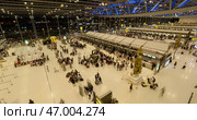 Norway, Stavanger, 08.01.2023: A Busy Airport Terminal filled with Travelers, Luggage, and Various CheckIn Counters. Редакционное фото, фотограф David Kashakhi / Фотобанк Лори