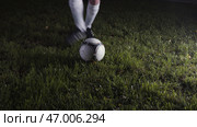 Football player hits ball at championship at night. Стоковое фото, фотограф David Kashakhi / Фотобанк Лори