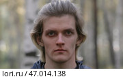 Psychological view of young man with maniac effect in forest. Стоковое фото, фотограф David Kashakhi / Фотобанк Лори