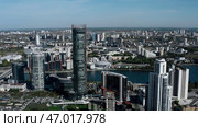 A magnificent landscape of a big city with beautiful houses and parks around the river. Стоковое фото, фотограф David Kashakhi / Фотобанк Лори