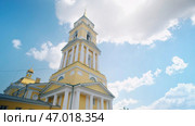 Low angle view of yellow Cathedral building on a blue cloudy summer sky background. Стоковое фото, фотограф David Kashakhi / Фотобанк Лори
