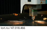 The process of cutting metal sheet by automatic laser machine. Стоковое фото, фотограф David Kashakhi / Фотобанк Лори