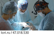 Close up of surgery performed by professional specialists. Стоковое фото, фотограф David Kashakhi / Фотобанк Лори