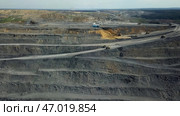 An Aerial View of an Extensive OpenPit Mining Operation and its Surrounding Areas. Стоковое фото, фотограф David Kashakhi / Фотобанк Лори