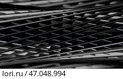 Metallic grid of narrow stripes forming rotating tube shaped figure, monochrome. Стоковое фото, фотограф David Kashakhi / Фотобанк Лори