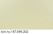 Abstract beige texture with rows of black circles. Стоковая иллюстрация, иллюстратор David Kashakhi / Фотобанк Лори