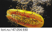 A Vibrant Slice of Papaya Presented on a Black Background, Exuding Freshness and Colorful Delight. Стоковое видео, видеограф Владимир Ковальчук / Фотобанк Лори