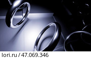 Close up of flying metal rings in a circle trajectory. Стоковая иллюстрация, иллюстратор David Kashakhi / Фотобанк Лори
