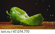 A Fresh Green Bell Pepper Sitting Beautifully on a Wooden Surface, Ideal for Cooking. Стоковое видео, видеограф Владимир Ковальчук / Фотобанк Лори