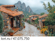 A picturesque mountain village with cobbled streets and stone houses with terracotta roofs. The atmosphere of the place seems cozy and slightly foggy, creating a feeling of privacy and peace. A narrow cobbled road gently descends, surrounded by greenery, flowers and potted plants. In the distance, majestic rocks are visible, partially hidden by a light fog, which gives the scene mystery and atmosphere. Everything in this picture breathes history, natural harmony and traditional architecture. Стоковое AI-изображение, AI-художник Анна Кривицкая / Фотобанк Лори