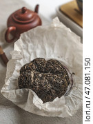 Experience the traditional Chinese Puerh Tea in a picturesque and natural setting. Стоковое фото, фотограф David Kashakhi / Фотобанк Лори