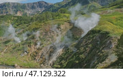 Hot springs and fumaroles in Valley of Geysers. Стоковое видео, видеограф Михаил Коханчиков / Фотобанк Лори