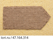 Pointer of burlap lying on a millet background. Стоковое фото, фотограф Александр Собко / Фотобанк Лори