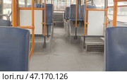 Empty blue seats and orange handrails in public transport in trolleybus. Стоковое видео, видеограф Дмитрий Нечаев / Фотобанк Лори