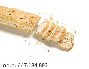 Вкусный нарезанный багет на белом фоне. Стоковое фото, фотограф Pixel_shot / Фотобанк Лори
