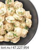 Чаша с вкусными варениками на белом фоне. Стоковое фото, фотограф Pixel_shot / Фотобанк Лори