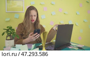 Blonde Bulgarian Woman Disapprovingly Looking at Phone Yellow Background. Стоковое видео, видеограф Mihail Mihaylov / Фотобанк Лори