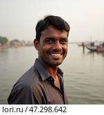 A man stands joyfully by the banks of the Ganges river in Varanasi, showcasing a warm smile that reflects the tranquility and cultural richness of the surroundings at dawn Generative AI. Стоковое AI-изображение, AI-художник Юлия Петровская / Фотобанк Лори