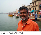 A joyful man stands by the serene waters of the Ganges River in Varanasi, surrounded by boats and lively people, capturing the essence of this ancient city Generative AI. Стоковое AI-изображение, AI-художник Юлия Петровская / Фотобанк Лори