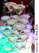 Celebration Cocktail Tower With Bubbling Effects for Festive Occasions. Стоковое фото, фотограф Aleksandr Golubev / Фотобанк Лори