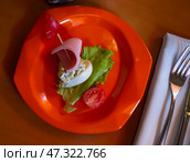 Devilled egg in shape of ship with sausage slice and fresh vegetables. Стоковое фото, фотограф Яков Филимонов / Фотобанк Лори
