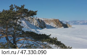Burkhan rock cape in frozen lake Baikal. Стоковое видео, видеограф Михаил Коханчиков / Фотобанк Лори