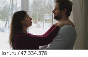 Emotional Dance. Middle-aged Couple Dancing Together Embrace at Home. Mature Couple dancing bonding, smiling and moving to the rhythm in a romantic vibe enjoying their anniversary. Active relationship. Стоковое видео, видеограф Марина Демидюк / Фотобанк Лори