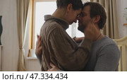 Loving mature couple interactions at home. Man and woman embracing, hugging, holding hands and dancing. Wife with husband intimate moments. couple is touching, cuddling, kissing. Natural lighting. 4K. Стоковое видео, видеограф Марина Демидюк / Фотобанк Лори