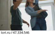 Emotional Dance. Middle-aged Couple Dancing Together Embrace at Home. Mature Couple dancing bonding, smiling and moving to the rhythm in a romantic vibe enjoying their anniversary. Active relationship. Стоковое видео, видеограф Марина Демидюк / Фотобанк Лори