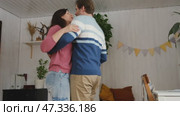Emotional Dance. Middle-aged Couple Dancing Together Embrace at Home. Mature Couple dancing bonding, smiling and moving to the rhythm in a romantic vibe enjoying their anniversary. Active relationship. Стоковое видео, видеограф Марина Демидюк / Фотобанк Лори