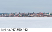 Skater on Ice Track at Sysert Pond in Winter, Russia. Стоковое фото, фотограф Ирина Кононова / Фотобанк Лори