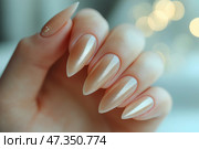 Elegant long nails featuring a subtle shimmer in neutral tones. Маникюр. На руке изящно изображены длинные миндалевидные ногти, сияющие мягким мерцанием. Ногти окрашены в нейтральные тона, что придает им изысканный и полированный вид. Стоковое AI-изображение, AI-художник Katsiaryna Repich / Фотобанк Лори