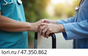 Two healthcare professionals provide compassionate support to a patient in rehabilitation. They gently hold hands, offering comfort and reassurance in a peaceful outdoor environment. Стоковое AI-изображение, AI-художник Sergey Grishin / Фотобанк Лори