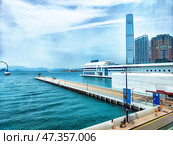 Hong Kong - April 10, 2025: Waterfront view of Hong Kong showcasing the skyline and harbor during a clear day. Редакционное фото, фотограф Кривошеина Елена Леонидовна / Фотобанк Лори