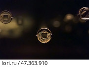 Abu Dhabi, United Arab Emirates - Jan 17 2024, Close-up view of the ancient antique coins in the Louvre Abu Dhabi Museum, belonging to different eras, Abu Dhabi, United Arab Emirates. Редакционное фото, фотограф Сергей Богомяко / Фотобанк Лори