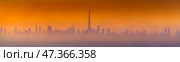 Dubai, United Arab Emirates - Jan 12 2024, Panoramic view of downtown Dubai skyscrapers, with Burj Khalifa in the middle, at dawn in a haze, a view from the sea, Dubai, United Arab Emirates. Стоковое фото, фотограф Сергей Богомяко / Фотобанк Лори