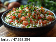 A delicious and colorful dish in a deep ceramic bowl. It consists of finely chopped tomatoes, onions, herbs (mostly parsley) and a base similar to rice, couscous or cauliflower. The ingredients are fresh, juicy and shiny, seasoned with spices, perhaps salt, lemon juice and olive oil. The dish resembles tabbouleh or a light vegetable salad popular in Eastern cuisine. The overall presentation is very aesthetically pleasing and evokes a feeling of freshness, lightness and healthiness. Стоковое AI-изображение, AI-художник Анна Кривицкая / Фотобанк Лори