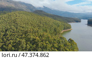 Aerial view beautiful nature with mountains and hills by Lake Mattupetty. Kerala State. Near the city of Munar. Стоковое фото, фотограф Mikhail Davidovich / Фотобанк Лори