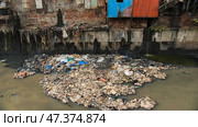 Dirty river in Dharavi slums. Mumbai. India. Стоковое фото, фотограф Mikhail Davidovich / Фотобанк Лори