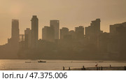 Sunset on the background of Mumbai skyscrapers. View from Chowpatty Beach. Стоковое фото, фотограф Mikhail Davidovich / Фотобанк Лори