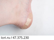 A patch on a man's leg. Protection against calluses on the foot. Стоковое фото, фотограф Александр Поташев / Фотобанк Лори