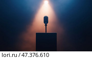 Minimalist depiction of an empty microphone under spotlight. Минималистское изображение пустого микрофона под светом прожектора. Стоковое AI-изображение, AI-художник Katsiaryna Repich / Фотобанк Лори