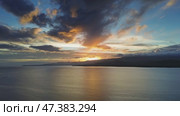 Sunset aerial over calm sea waters. Стоковое видео, видеограф Михаил Коханчиков / Фотобанк Лори