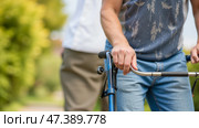 Adjustable mobility walker for elderly and injured individuals, promoting safe recovery and physical therapy support, featuring durable lightweight frame and comfortable handgrips. Стоковое AI-изображение, AI-художник Павел Муравьев / Фотобанк Лори