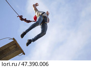 Belarus, Gomel, May 06 2017.Jumping with a rope.Flight down on the rope.Engage in ropejumping.Dangerous hobbies. Редакционное фото, фотограф Лазаренко Светлана / Фотобанк Лори
