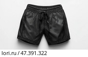 Stylish black athletic shorts designed for comfort during exercise. Стильные черные спортивные шорты, созданные для комфорта во время тренировок. Стоковое AI-изображение, AI-художник Katsiaryna Repich / Фотобанк Лори