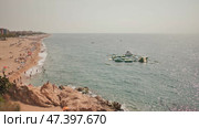 Calella, Spain - August 9, 2018: People at beach in Calella city. Spain. Редакционное видео, видеограф Mikhail Davidovich / Фотобанк Лори